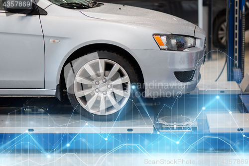 Image of car on lift at repair station