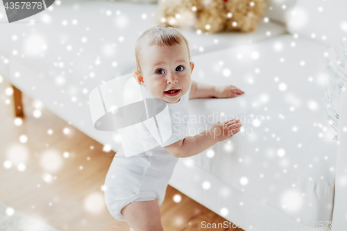 Image of happy little baby boy or girl at home