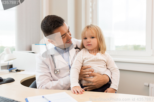 Image of doctor or pediatrician with girl patient at clinic