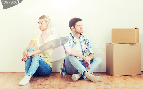 Image of unhappy couple having argument at home