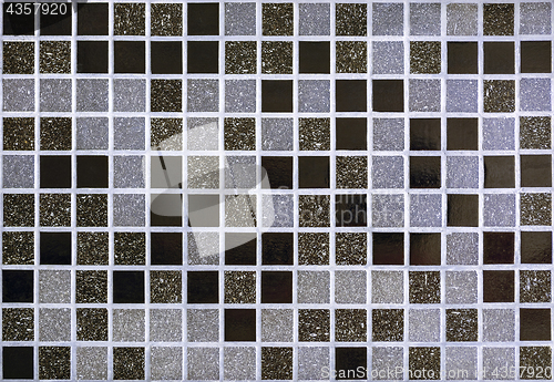 Image of Wall is lined with mosaic.
