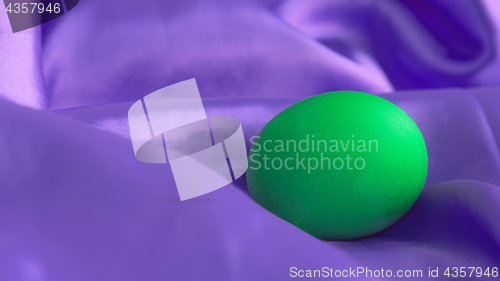 Image of Green Egg On Violet Canvas