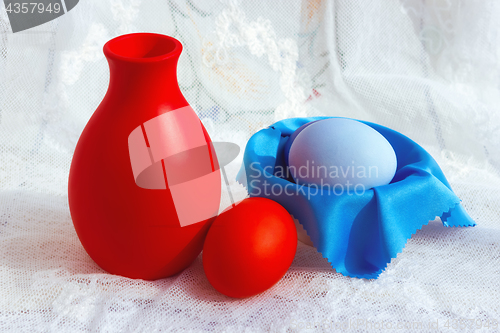 Image of Colorful Easter Eggs And A Jug On A Lace