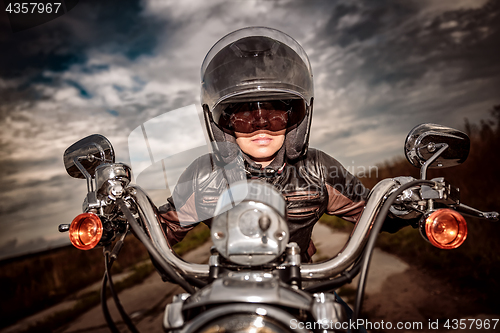 Image of Biker girl on a motorcycle