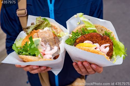 Image of Fast street food seafood. Norway Lofoten Islands, fish cutlet wi