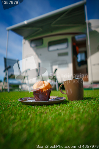 Image of Coffee Mug on grass. Family vacation travel, holiday trip in mot