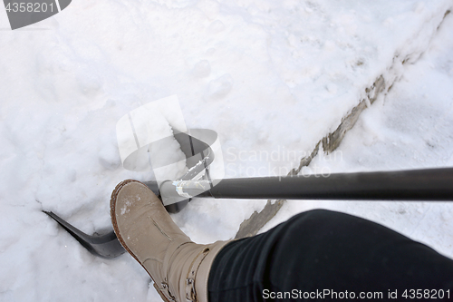 Image of Woman Shoveling snow 