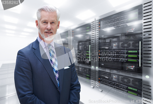 Image of Senior businessman in server room