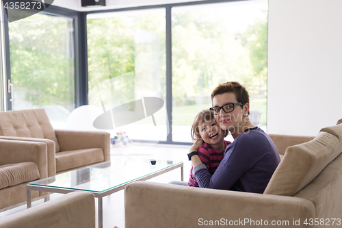 Image of mother and cute little girl enjoying their free time