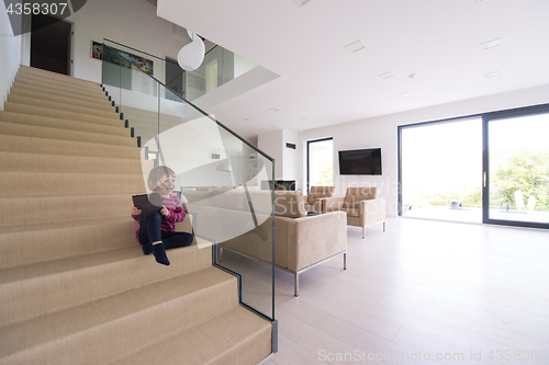 Image of little cute girl enjoying on the stairs