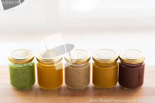 Image of vegetable or fruit puree or baby food in jars