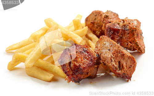 Image of fried potatoes and pork kebab