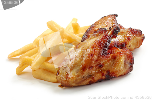 Image of fried potatoes and chicken wings