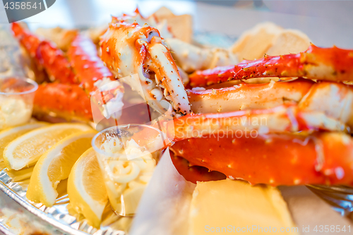 Image of Red king crab legs with fresh lemon slices