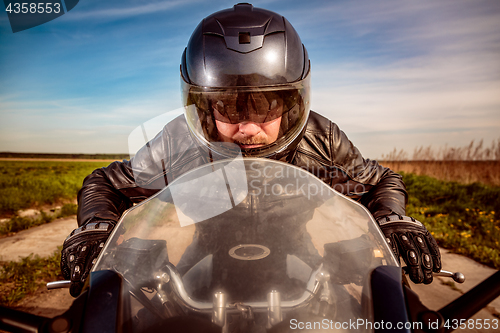 Image of Biker racing on the road