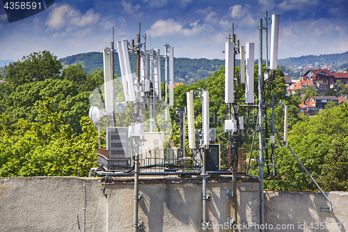 Image of Telecommunications equipment, mobile phone antennas in the city