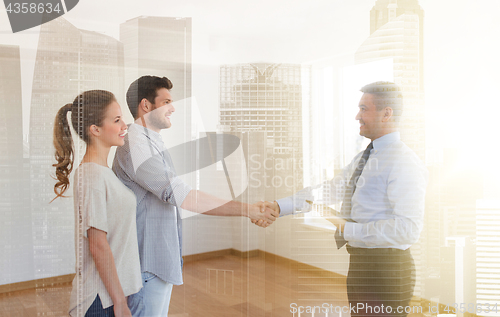 Image of man and realtor shaking hands at new home