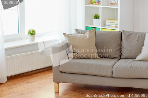 Image of sofa with cushions at cozy home living room