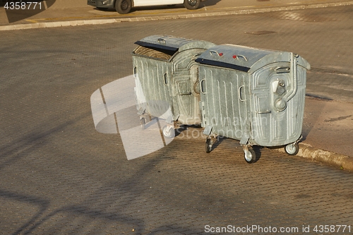 Image of Garbage Containers in a urban area