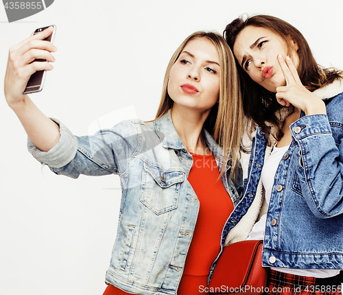 Image of best friends teenage girls together having fun, posing emotional on white background, besties happy smiling, lifestyle people concept close up