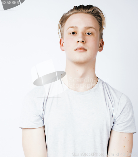 Image of young handsome teenage hipster guy posing emotional, happy smiling against white background isolated, lifestyle people concept