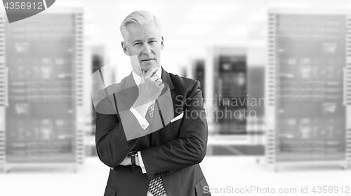 Image of Senior businessman in server room