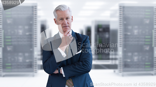 Image of Senior businessman in server room