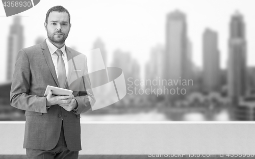 Image of Young businessman in front of the big city