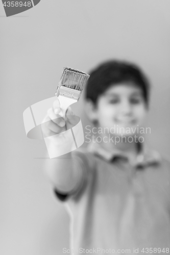 Image of Portrait of a happy young boy painter