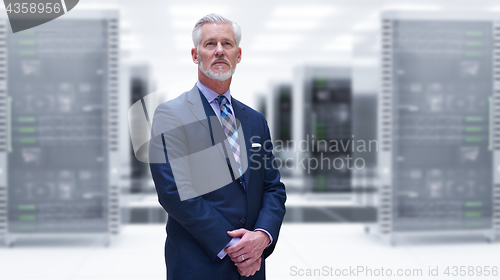 Image of Senior businessman in server room