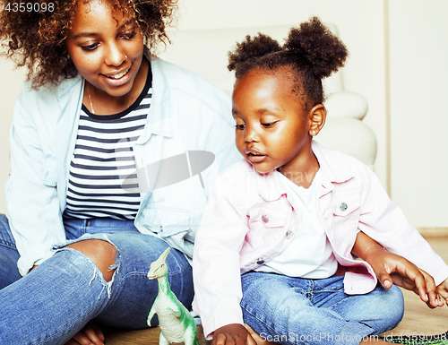 Image of adorable sweet young afro-american mother with cute little daugh