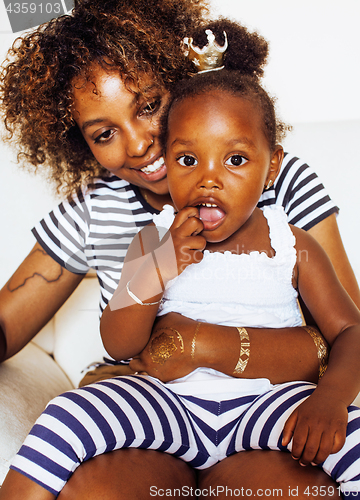 Image of adorable sweet young afro-american mother with cute little daugh