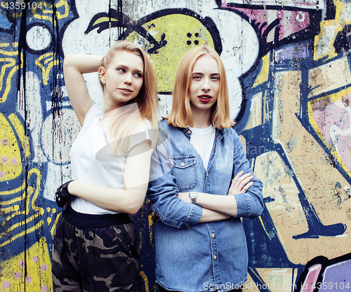 Image of two cool blond real girls friends making selfie on roof top, lif