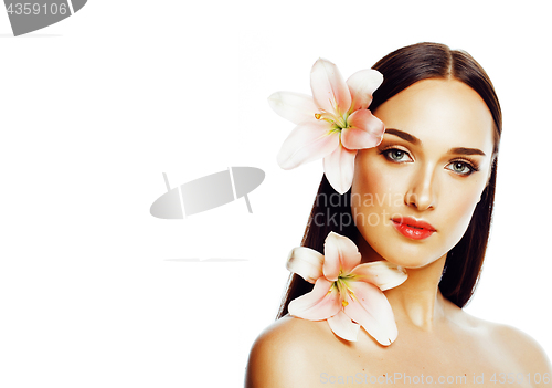 Image of young attractive lady close up with hands on face isolated flowe
