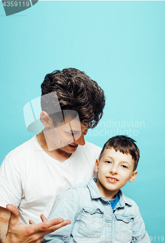 Image of young pretty man model with little cute son playing together, lifestyle modern people concept, family male 