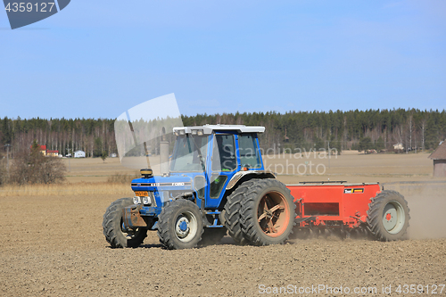 Image of Ford 6610 Tractor and Seeder on Field at Spring