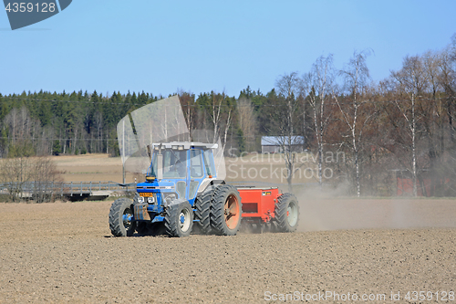 Image of Ford 6610 Tractor and Seeder on Field