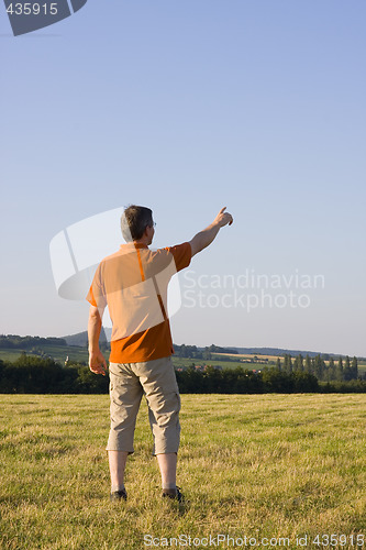 Image of Man pointing with outstretched arm