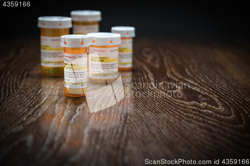 Image of Variety of Non-Proprietary Prescription Medicine Bottles on Refl