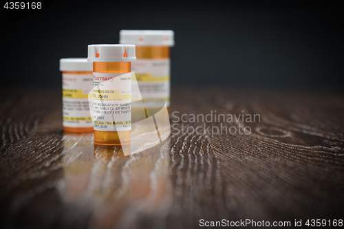 Image of Variety of Non-Proprietary Prescription Medicine Bottles on Refl