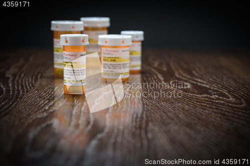 Image of Variety of Non-Proprietary Prescription Medicine Bottles on Refl