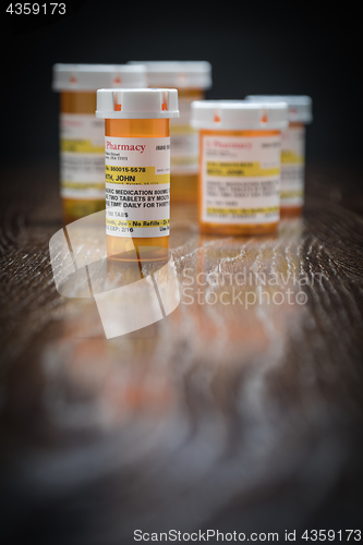 Image of Variety of Non-Proprietary Prescription Medicine Bottles on Refl