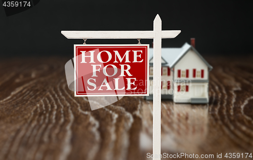 Image of For Sale Real Estate Sign In Front of Model Home on Reflective W