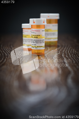 Image of Variety of Non-Proprietary Prescription Medicine Bottles on Refl