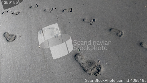 Image of footprints on sand