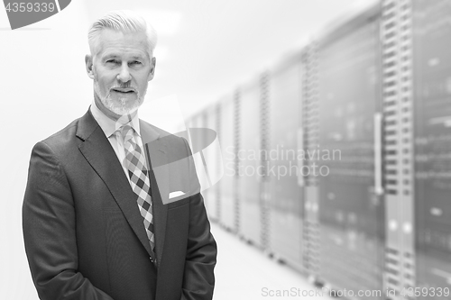 Image of Senior businessman in server room