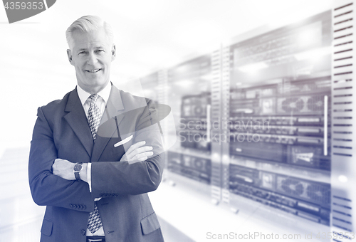 Image of Senior businessman in server room