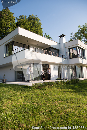 Image of couple enjoying on the door of their luxury home villa