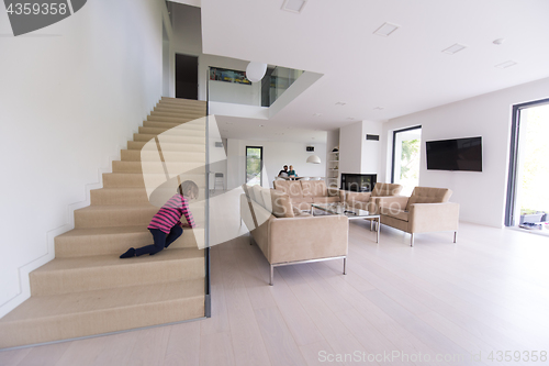 Image of family with little girl enjoys in the modern living room