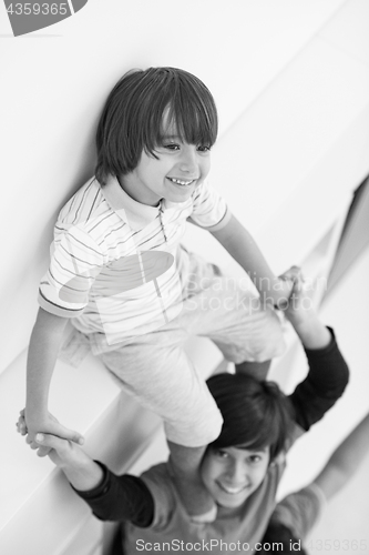 Image of young boys posing line up piggyback top view